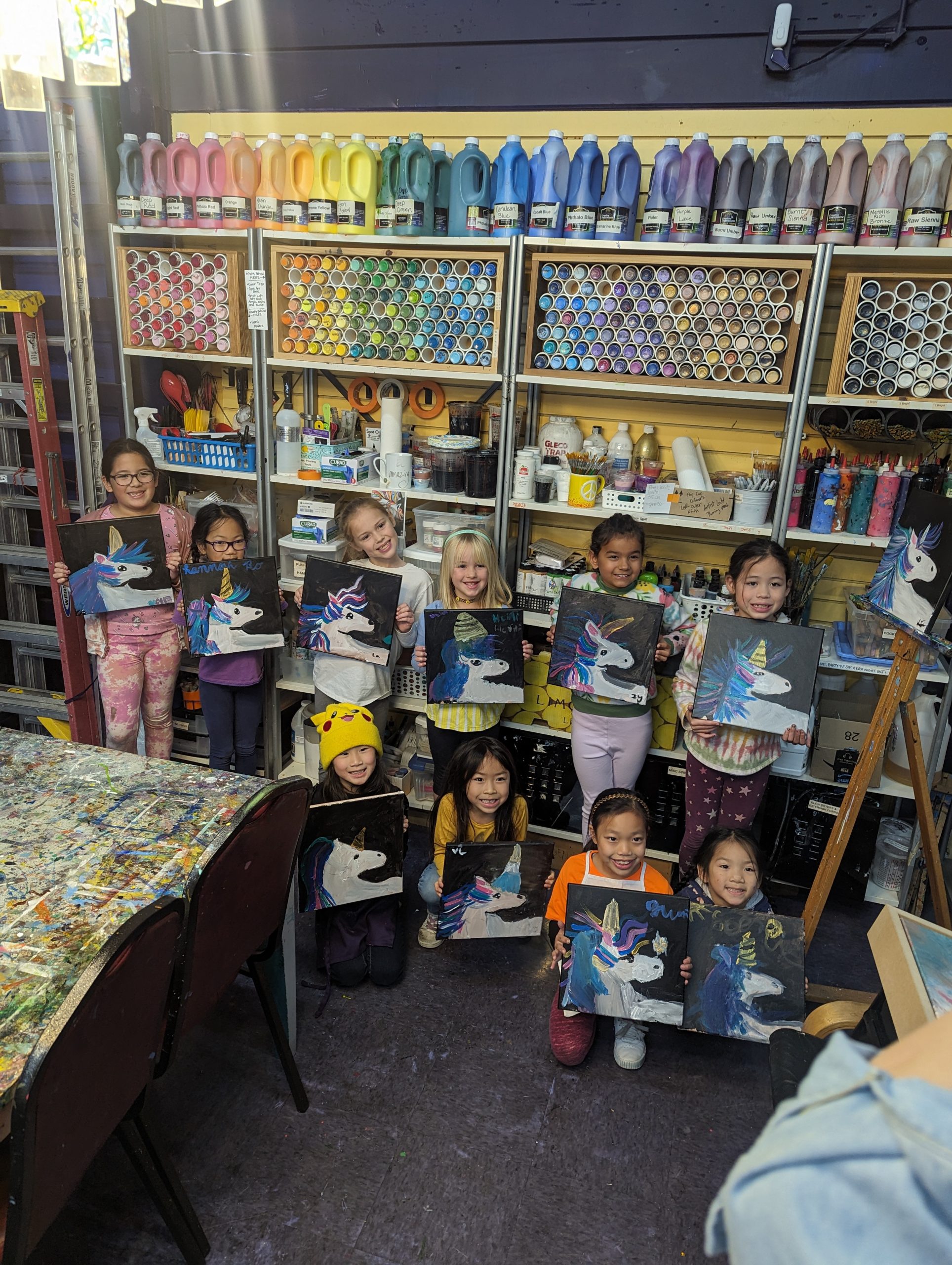 Kids with their paintings